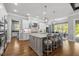 Gourmet kitchen with stainless steel appliances, large island, and eat-in area with natural light at 623 Westfall Way, Chapel Hill, NC 27517