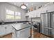 Functional laundry room with ample counter space, sink, and modern appliances at 623 Westfall Way, Chapel Hill, NC 27517