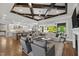 Spacious living room with coffered ceilings, hardwood floors, and seamless flow to the kitchen at 623 Westfall Way, Chapel Hill, NC 27517