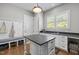 Inviting mud room with built-in storage, bench seating, and natural light at 623 Westfall Way, Chapel Hill, NC 27517
