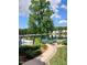 View of the backyard with a pool and pond at 631 Springfork Dr, Cary, NC 27513