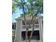 Close up of the building balcony with a tree, and a glimpse of furnishings at 631 Springfork Dr, Cary, NC 27513