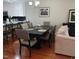 Open-concept dining area features a dark table and stylish chairs in a well-lit space at 631 Springfork Dr, Cary, NC 27513