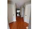 Hallway with wooden floors leading into the living room at 631 Springfork Dr, Cary, NC 27513