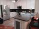 Well-equipped kitchen features stainless steel appliances, ample cabinetry, and a breakfast bar at 631 Springfork Dr, Cary, NC 27513