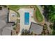 Aerial view of a backyard swimming pool with a patio and lush landscaping at 6500 Bass Mountain Rd, Snow Camp, NC 27349
