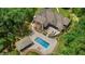 Breathtaking aerial view showcasing the home, pool, patio area, and surrounding landscape at 6500 Bass Mountain Rd, Snow Camp, NC 27349
