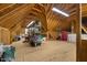 Expansive attic space is ideal for storage with open rafters and built-in shelving at 6500 Bass Mountain Rd, Snow Camp, NC 27349