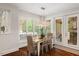 Cozy dining area with shuttered windows, hardwood floors and access to the outdoors at 6500 Bass Mountain Rd, Snow Camp, NC 27349