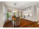 Bright dining room with a pendant light fixture, hardwood floors and lots of natural light at 6500 Bass Mountain Rd, Snow Camp, NC 27349