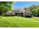 Charming home with manicured lawn and mature trees providing shade and privacy at 6500 Bass Mountain Rd, Snow Camp, NC 27349