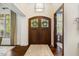 Inviting foyer with hardwood floors and a striking front door with decorative glass at 6500 Bass Mountain Rd, Snow Camp, NC 27349