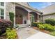 Charming front entrance with stone accents, a double door, and beautiful landscaping at 6500 Bass Mountain Rd, Snow Camp, NC 27349