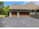 Charming stone house with a spacious two-car garage and blacktop driveway at 6500 Bass Mountain Rd, Snow Camp, NC 27349