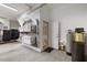 Spacious garage with storage cabinets, water filtration system, and an adjacent interior door at 6500 Bass Mountain Rd, Snow Camp, NC 27349