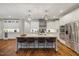 Gourmet kitchen featuring a large center island, stainless steel appliances, and custom cabinetry at 6500 Bass Mountain Rd, Snow Camp, NC 27349