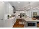 Open kitchen layout with granite countertops, custom cabinets and stainless steel appliances at 6500 Bass Mountain Rd, Snow Camp, NC 27349