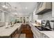 Spacious kitchen features marble countertops, stainless steel appliances and hardwood flooring at 6500 Bass Mountain Rd, Snow Camp, NC 27349