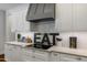 Modern kitchen details including sleek countertops, stylish backsplash, and custom cabinetry at 6500 Bass Mountain Rd, Snow Camp, NC 27349
