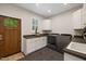 Well-appointed laundry room with granite countertops, plenty of cabinets, and a modern washer and dryer at 6500 Bass Mountain Rd, Snow Camp, NC 27349