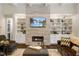 Comfortable living room with a stone fireplace and built-in shelving at 6500 Bass Mountain Rd, Snow Camp, NC 27349