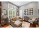 Bright living room with a plush sectional sofa and an accent chair near a window at 6500 Bass Mountain Rd, Snow Camp, NC 27349