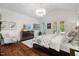Bright bedroom featuring a vaulted ceiling, chandelier, and private seating area at 6500 Bass Mountain Rd, Snow Camp, NC 27349