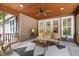 Enjoy outdoor living with this covered porch, featuring ample seating and stylish decor at 6500 Bass Mountain Rd, Snow Camp, NC 27349