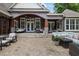 Expansive patio with stylish seating, a porch swing, and ample room for entertaining at 6500 Bass Mountain Rd, Snow Camp, NC 27349