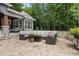 Spacious patio with stylish sectional seating and a fire pit, perfect for outdoor gatherings at 6500 Bass Mountain Rd, Snow Camp, NC 27349