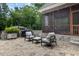 Beautiful outdoor patio features stone flooring, comfortable seating and a grill for outdoor dining at 6500 Bass Mountain Rd, Snow Camp, NC 27349