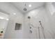 Stunning marble tiled shower equipped with rainfall and handheld shower heads at 6500 Bass Mountain Rd, Snow Camp, NC 27349
