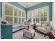 Charming light-filled sitting room with shuttered windows and comfortable seating at 6500 Bass Mountain Rd, Snow Camp, NC 27349