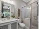 Elegant bathroom featuring a modern vanity, glass-enclosed shower, and contemporary finishes at 67 Spring Hollow Ct, Pittsboro, NC 27312