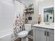 Well-lit bathroom showcasing shower and tub combination with modern floral shower curtain at 67 Spring Hollow Ct, Pittsboro, NC 27312