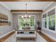 Dining room with natural light, hardwood floors, a decorative chandelier and wood accents at 67 Spring Hollow Ct, Pittsboro, NC 27312