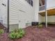 Rear exterior featuring a white painted crawl space door and white siding at 67 Spring Hollow Ct, Pittsboro, NC 27312