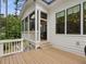 Exterior view of home showing deck, screened porch, and architectural details at 67 Spring Hollow Ct, Pittsboro, NC 27312