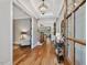 Elegant foyer showcasing hardwood floors, a decorative chandelier, and views of the living spaces at 67 Spring Hollow Ct, Pittsboro, NC 27312