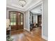 Entryway highlighting hardwood flooring and stylish glass panel double doors leading to the outside at 67 Spring Hollow Ct, Pittsboro, NC 27312