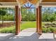 Covered front porch offering picturesque views of the lush lawn and surrounding trees at 67 Spring Hollow Ct, Pittsboro, NC 27312