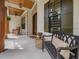 Welcoming covered front porch with wood accents, a cozy bench, and views of the landscaped yard at 67 Spring Hollow Ct, Pittsboro, NC 27312