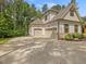 Spacious three-car garage and driveway providing ample parking at 67 Spring Hollow Ct, Pittsboro, NC 27312