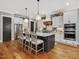 Beautiful kitchen showcases an island with seating, stainless steel appliances, and ample storage solutions at 67 Spring Hollow Ct, Pittsboro, NC 27312