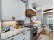 Gourmet kitchen with stone countertops, modern appliances, and ample counter space at 67 Spring Hollow Ct, Pittsboro, NC 27312