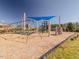 Community playground featuring swings and a climbing wall for residents to enjoy at 67 Spring Hollow Ct, Pittsboro, NC 27312