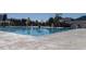 Large community pool with marked lanes and lounge chairs, ideal for swimming and socializing at 67 Spring Hollow Ct, Pittsboro, NC 27312