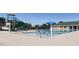 Community pool featuring a splash zone and poolside seating, perfect for relaxation and recreation at 67 Spring Hollow Ct, Pittsboro, NC 27312