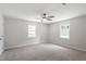 Bedroom with neutral carpet, ceiling fan, and bright windows at 7216 Carlton Dr, Raleigh, NC 27616