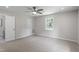 Bright bedroom with neutral walls, carpeted floors, a ceiling fan, and a window with natural light at 7216 Carlton Dr, Raleigh, NC 27616